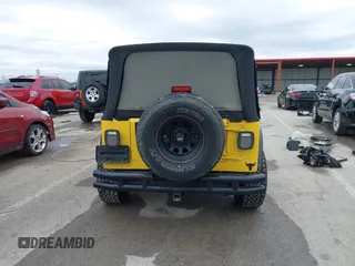 2000 Jeep Wrangler SE with VIN 1J4FA29P2YP797156, listed as a IAAI auction lot 41517183 with 114,236 mi miles. Bid and sale history available at carsss.com. Image 16.