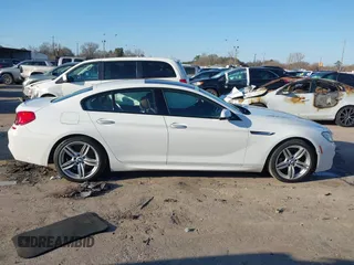 2015 BMW 6 Series 640i xDrive with VIN WBA6B8C50FD453317, listed as a IAAI auction lot 41635430 with 77,811 mi miles and . Bid and sale history available at DreamBid. Image 13.