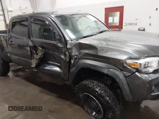 2017 Toyota Tacoma SR5 with VIN 3TMDZ5BN8HM016825, listed as a IAAI auction lot 41658400 with 166,098 mi miles. Bid and sale history available at carsss.com. Image 6.