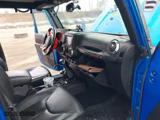 2016 Jeep Wrangler Unlimited Rubicon with VIN 1C4BJWFG2GL192074, listed as a IAAI auction lot 41598861 with 70,000 mi miles. Bid and sale history available at carsss.com. Image 5.