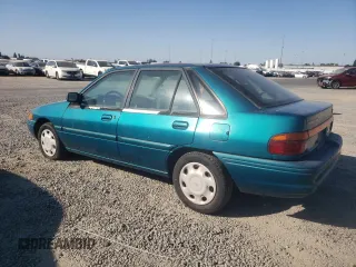 1995 Ford Escort z VIN 1FASP14J9SW304866, wystawiony jako Copart lot #73006174 z przebiegiem 126 068 mil mil oraz Szkoda całkowita • Salvage title. Historia ofert i sprzedaży dostępna na DreamBid. Obrazek 2.