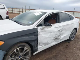 2019 Ford Fusion Titanium with VIN 3FA6P0D93KR138574, listed as a IAAI auction lot 41967094 with 118,297 mi miles. Bid and sale history available at carsss.com. Image 6.