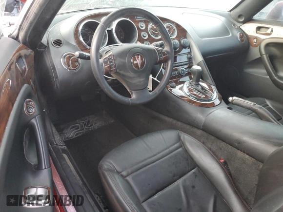 2009 Pontiac Solstice GXP z VIN 1G2MT35X59Y105202, wystawiony jako Copart lot #74429594 z przebiegiem Nie podano mil oraz Szkoda całkowita • Salvage title. Historia ofert i sprzedaży dostępna na DreamBid. Obrazek 8.