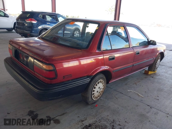 1990 Toyota Corolla z VIN 1NXAE94A1LZ117401, wystawiony jako IAAI lot #41755431 z przebiegiem 81 786 mil mil oraz . Historia ofert i sprzedaży dostępna na DreamBid. Obrazek 4.