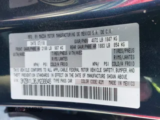 2018 Mazda 3 Touring z VIN 3MZBN1L36JM238646, wystawiony jako IAAI lot #41376772 z przebiegiem 97 261 mil mil oraz . Historia ofert i sprzedaży dostępna na DreamBid. Obrazek 9.