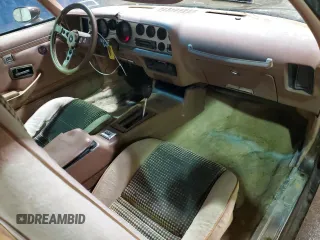 1979 Pontiac Firebird z VIN 2W87K9N184050, wystawiony jako Copart lot #75937874 z przebiegiem 18 509 mil mil oraz Szkody całkowita. Historia ofert i sprzedaży dostępna na DreamBid. Obrazek 8.