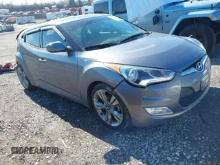 2016 Hyundai Veloster with VIN KMHTC6AD9GU264048, listed as a IAAI auction lot 41634443 with 103,758 mi miles. Bid and sale history available at carsss.com. Image 1.