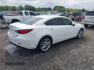 2016 Mazda 6 i Touring with VIN JM1GJ1V56G1448334, listed as a IAAI auction lot 42075222 with 52,883 mi miles. Bid and sale history available at carsss.com. Image 4.