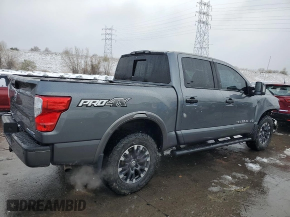 2018 Nissan Titan Pro-4X z VIN 1N6AA1E51JN536680, wystawiony jako Copart lot #82361724 z przebiegiem 98 699 mil mil oraz Szkoda całkowita • Salvage title. Historia ofert i sprzedaży dostępna na DreamBid. Obrazek 3.