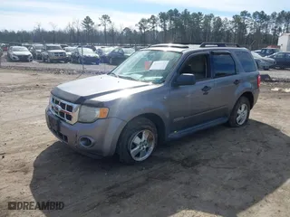 2008 Ford Escape XLT with VIN 1FMCU03178KA47527, listed as a IAAI auction lot 41672719 with 306,312 mi miles. Bid and sale history available at carsss.com. Image 2.