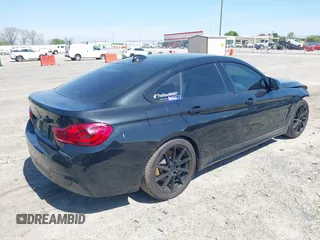 2019 BMW 4 Series 430i with VIN WBA4J1C59KBM17309, listed as a IAAI auction lot 42011443 with 87,189 mi miles. Bid and sale history available at carsss.com. Image 4.