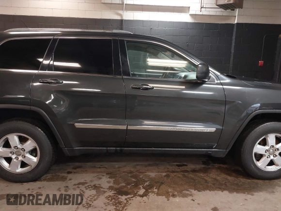 2011 Jeep Grand Cherokee 70th Anniversary with VIN 1J4RR4GG3BC566690, listed as a IAAI auction lot 41810545 with 173,886 mi miles. Bid and sale history available at carsss.com. Image 13.