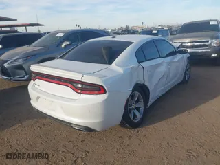 2015 Dodge Charger SE with VIN 2C3CDXBG5FH879783, listed as a IAAI auction lot 41500193 with 83,386 mi miles. Bid and sale history available at carsss.com. Image 4.