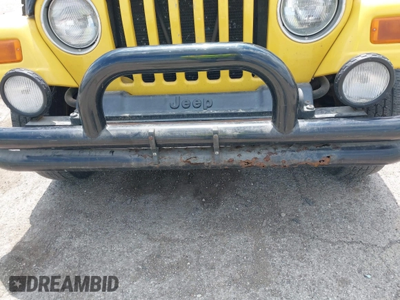 2004 Jeep Wrangler Sport z VIN 1J4FA49S04P701986, wystawiony jako IAAI lot #42256648 z przebiegiem 129 946 mil mil oraz . Historia ofert i sprzedaży dostępna na DreamBid. Obrazek 6.