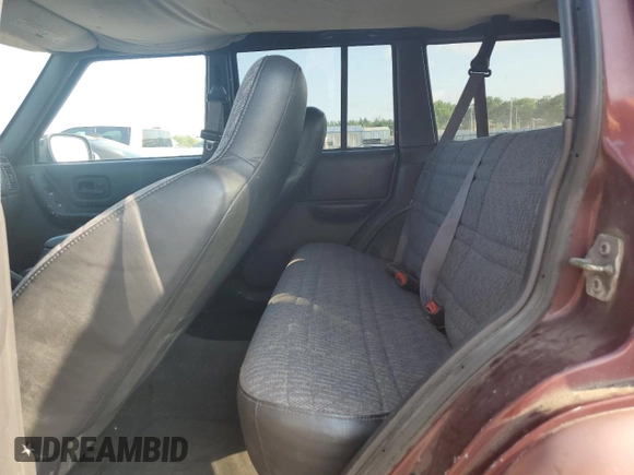 2000 Jeep Cherokee z VIN 1J4FF48S2YL135037, wystawiony jako Copart lot #66156505 z przebiegiem 72 433 mil mil oraz Szkoda całkowita • Salvage title. Historia ofert i sprzedaży dostępna na DreamBid. Obrazek 10.