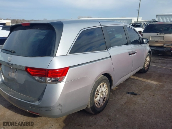 2015 Honda Odyssey LX with VIN 5FNRL5H27FB027143, listed as a IAAI auction lot 41239939 with 125,732 mi miles. Bid and sale history available at carsss.com. Image 4.