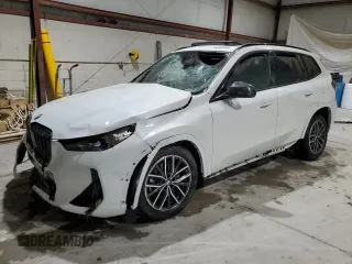 2023 BMW X1 xDrive28i with VIN WBX73EF08P5X60980, listed as a Copart auction lot 59899385 with 21,975 mi miles and Salvage title. Bid and sale history available at DreamBid. Image 1.