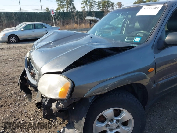 2004 Mazda Tribute LX with VIN 4F2CZ941X4KM19302, listed as a IAAI auction lot 41791389 with 123,036 mi miles. Bid and sale history available at carsss.com. Image 13.