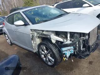 2017 Hyundai Veloster with VIN KMHTC6AD2HU324740, listed as a IAAI auction lot 41574415 with 66,685 mi miles. Bid and sale history available at carsss.com. Image 1.