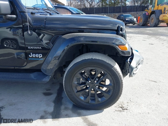 2023 Jeep Wrangler 4xe Sahara with VIN 1C4JJXP62PW613040, listed as a IAAI auction lot 41489171 with 36,818 mi miles. Bid and sale history available at carsss.com. Image 19.