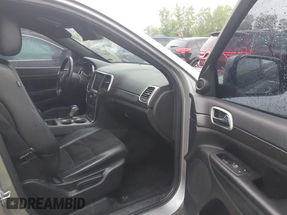 2018 Jeep Grand Cherokee Laredo E with VIN 1C4RJFAG6JC452859, listed as a IAAI auction lot 42647127 with 107,869 mi miles and . Bid and sale history available at DreamBid. Image 5.