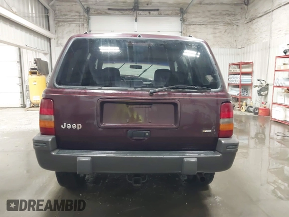 1995 Jeep Grand Cherokee Laredo with VIN 1J4GZ58S2SC679918, listed as a IAAI auction lot 41840415 with 261,434 mi miles. Bid and sale history available at carsss.com. Image 16.