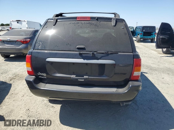 2004 Jeep Grand Cherokee Laredo with VIN 1J4GW48S84C182135, listed as a Copart auction lot 62224975 with 187,938 mi miles and Clean title. Bid and sale history available at DreamBid. Image 6.