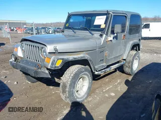 2002 Jeep Wrangler Sport with VIN 1J4FA49SX2P732367, listed as a IAAI auction lot 41805923 with 204,757 mi miles. Bid and sale history available at carsss.com. Image 17.