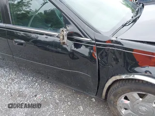 2002 Cadillac DeVille DTS z VIN 1G6KF579320288667, wystawiony jako IAAI lot #42331236 z przebiegiem 71 189 mil mil oraz . Historia ofert i sprzedaży dostępna na DreamBid. Obrazek 19.