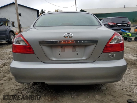 2002 Infiniti Q45 z VIN JNKBF01A52M002920, wystawiony jako Copart lot #73249364 z przebiegiem 95 955 mil mil oraz Tytuł czysty. Historia ofert i sprzedaży dostępna na DreamBid. Obrazek 6.