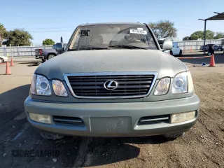 2002 Lexus LX 470 z VIN JTJHT00W723519186, wystawiony jako Copart lot #70190464 z przebiegiem 306 793 mil mil oraz Tytuł czysty. Historia ofert i sprzedaży dostępna na DreamBid. Obrazek 5.