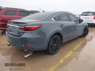 2021 Mazda 6 Carbon Edition with VIN JM1GL1WY0M1600414, listed as a IAAI auction lot 41551393 with 36,780 mi miles and . Bid and sale history available at DreamBid. Image 4.