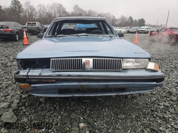 1991 Oldsmobile Cutlass z VIN 1G3AL54N3M6343029, wystawiony jako Copart lot #43965995 z przebiegiem 198 977 mil mil oraz Szkody całkowita. Historia ofert i sprzedaży dostępna na DreamBid. Obrazek 5.