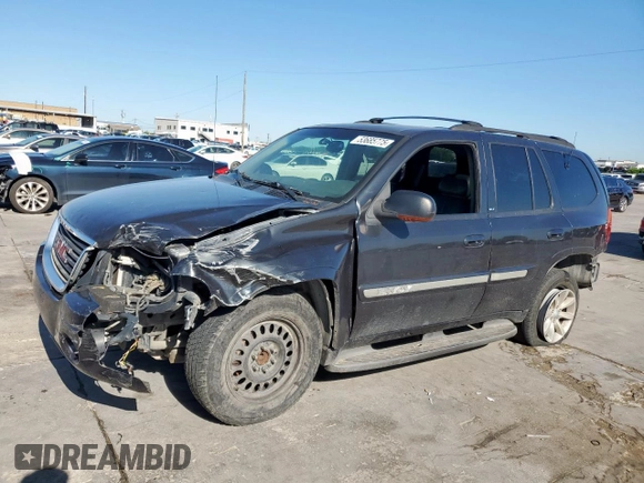 2003 GMC Envoy SLT z VIN 1GKDS13S332281271, wystawiony jako Copart lot #53685775 z przebiegiem 236 997 mil mil oraz Szkody całkowita. Historia ofert i sprzedaży dostępna na DreamBid. Obrazek 1.