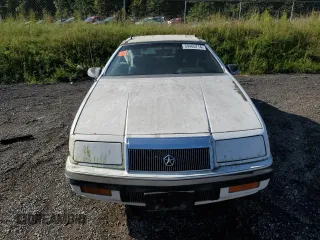 1992 Chrysler LeBaron z VIN 1C3XU553XNF239048, wystawiony jako Copart lot #69465714 z przebiegiem Nie podano mil oraz Tytuł czysty. Historia ofert i sprzedaży dostępna na DreamBid. Obrazek 5.