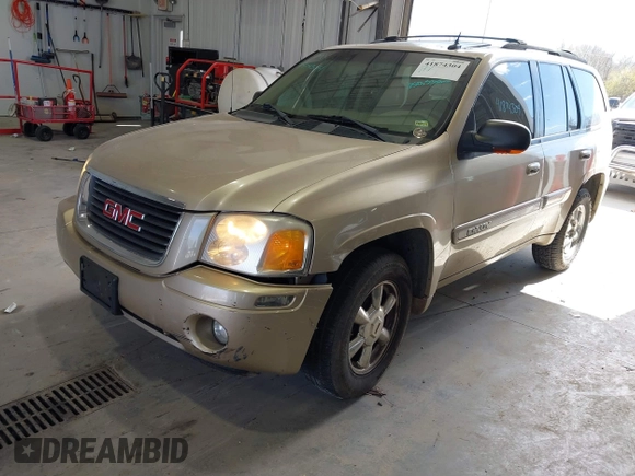2004 GMC Envoy SLE with VIN 1GKDT13S442136464, listed as a IAAI auction lot 41874304 with 250,330 mi miles. Bid and sale history available at carsss.com. Image 2.