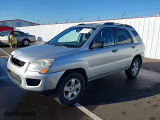 2009 Kia Sportage LX with VIN KNDJE723X97575927, listed as a IAAI auction lot 41014278 with 143,376 mi miles. Bid and sale history available at carsss.com. Image 2.