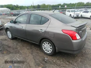 2015 Nissan Versa SV with VIN 3N1CN7AP7FL869485, listed as a IAAI auction lot 42077524 with 198,646 mi miles. Bid and sale history available at carsss.com. Image 3.