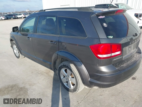 2014 Dodge Journey SE with VIN 3C4PDCAB0ET283756, listed as a IAAI auction lot 41490472 with 122,695 mi miles. Bid and sale history available at carsss.com. Image 3.