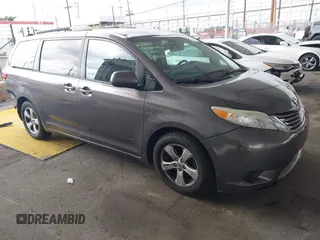 2015 Toyota Sienna LE AAS with VIN 5TDKK3DC8FS585957, listed as a IAAI auction lot 41888825 with 157,364 mi miles and . Bid and sale history available at DreamBid. Image 1.