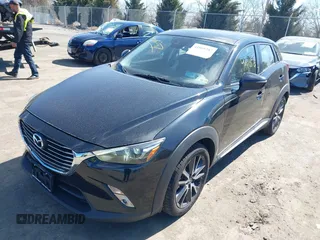 2018 Mazda CX-3 Grand Touring z VIN JM1DKFD75J0312662, wystawiony jako IAAI lot #41805287 z przebiegiem 140 083 mil mil oraz . Historia ofert i sprzedaży dostępna na DreamBid. Obrazek 2.
