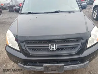 2005 Honda Pilot EX-L with NAVI with VIN 2HKYF187X5H572423, listed as a IAAI auction lot 42088750 with 203,265 mi miles. Bid and sale history available at carsss.com. Image 6.