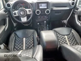 2015 Jeep Wrangler Unlimited Sport with VIN 1C4BJWDG9FL759012, listed as a Copart auction lot 61002465 with 101,395 mi miles and Salvage title. Bid and sale history available at DreamBid. Image 8.