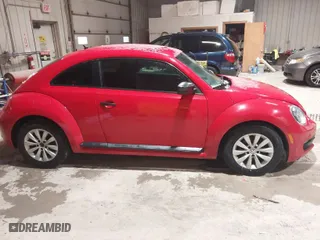 2016 Volkswagen Beetle Coupe 1.8T Wolfsburg Edition with VIN 3VWF17AT2GM619843, listed as a IAAI auction lot 41829023 with 147,716 mi miles. Bid and sale history available at carsss.com. Image 13.