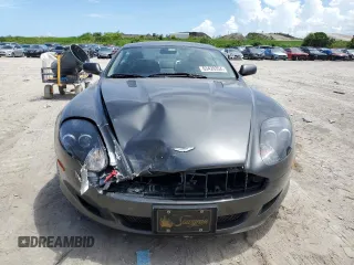 2005 Aston Martin DB9 z VIN SCFAD01A95GA00873, wystawiony jako Copart lot #63428354 z przebiegiem Nie podano mil oraz Szkody całkowita. Historia ofert i sprzedaży dostępna na DreamBid. Obrazek 5.