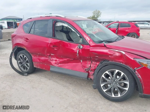 2016 Mazda CX-5 Grand Touring with VIN JM3KE4DYXG0641174, listed as a IAAI auction lot 41182655 with NaN miles. Bid and sale history available at carsss.com. Image 6.