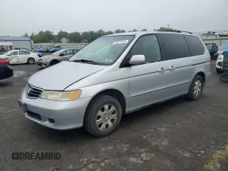 2002 Honda Odyssey EX with VIN 2HKRL18602H525790, listed as a Copart auction lot 61571015 with 146,935 mi miles and Salvage title. Bid and sale history available at DreamBid. Image 1.
