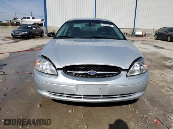 2003 Ford Taurus LX Standard z VIN 1FAFP52U93A159333, wystawiony jako Copart lot #78080944 z przebiegiem 54 652 mil mil oraz Szkoda całkowita • Salvage title. Historia ofert i sprzedaży dostępna na DreamBid. Obrazek 5.