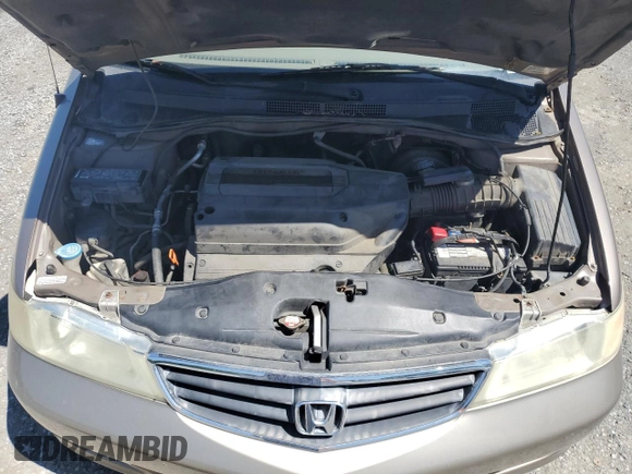 2004 Honda Odyssey LX with VIN 5FNRL18574B102634, listed as a Copart auction lot 54669075 with 141,057 mi miles and Salvage title. Bid and sale history available at DreamBid. Image 12.