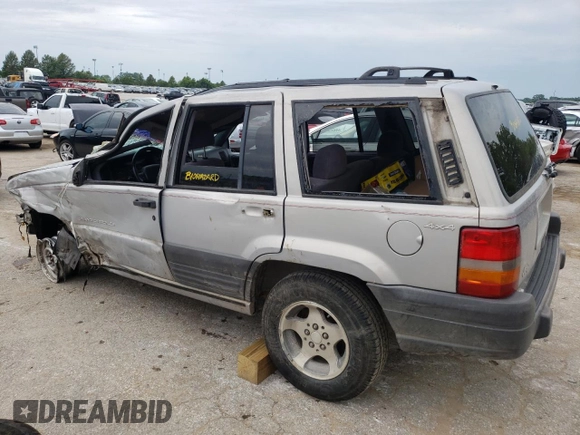 1996 Jeep Grand Cherokee Laredo with VIN 1J4GZ58S2TC401845, listed as a Copart auction lot 61013044 with 0 mi miles and Salvage Title. Bid and sale history available at carsss.com. Image 2.